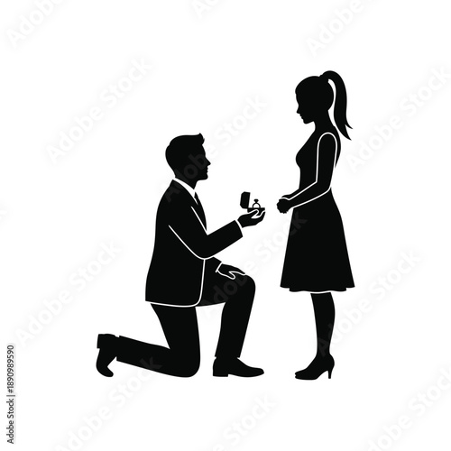 Silhouette of a man kneeling and proposing with a ring to a woman
