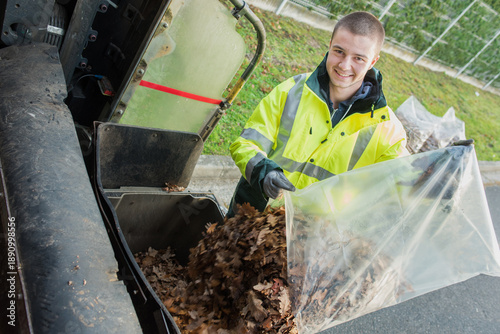 portrait of dustman collecting leaves