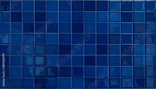 Glossy dark blue ceramic tiles arranged in a uniform square grid with narrow grout lines and polished surface.