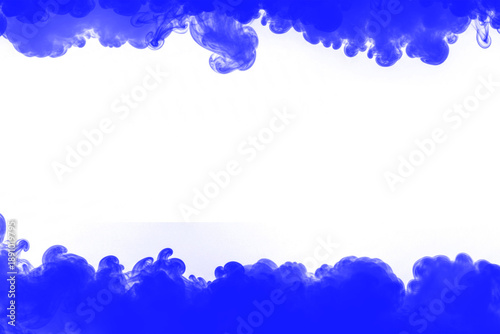 Photos Brilliant royal blue colored smoke or ink swirls abstractly mixing within absolu