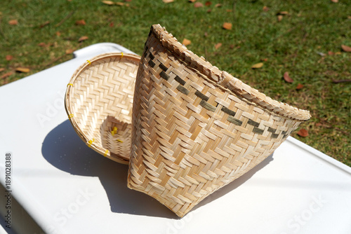 Handmade woven bamboo steamer set for sticky rice. Natural eco-friendly wicker basket and lid craft.A traditional Southeast Asian kitchen tool.Authentic handmade wickerwork from Thailand.Organic cooki