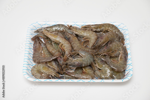 Raw Shrimp in Foam Tray Isolated on White Background