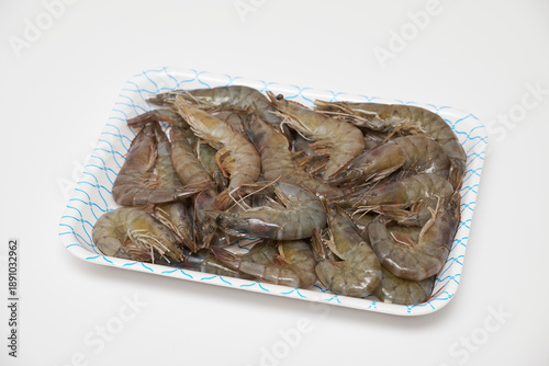 Raw Shrimp in Foam Tray Isolated on White Background