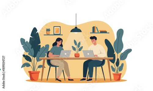 Two people working on laptops at a desk in a modern office space surrounded by plants