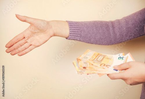 woman holding a euro banknotes in hand