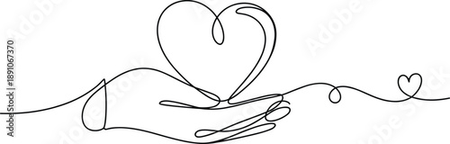 Hand Holding a Large Heart with Smaller Heart Floating Away 1