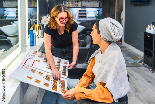 Photography Hairdresser advising client on hair color selection