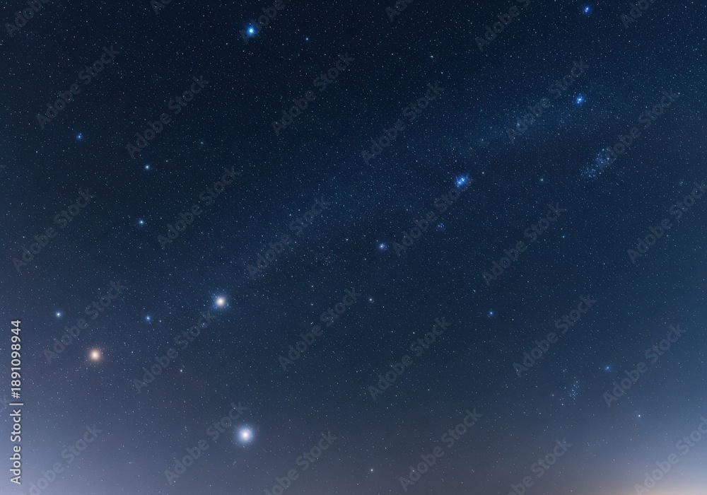 Fototapeta premium Clear night sky sprinkled with bright stars arching in a faint band of the Milky Way, a tranquil celestial dome above the fading glow of dusk