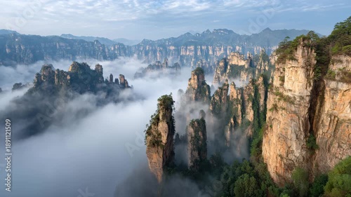 4K Majestic zhangjiajie national forest park landscape with towering sandstone pillars emerging from a sea of mist at sunrise, hunan, china video