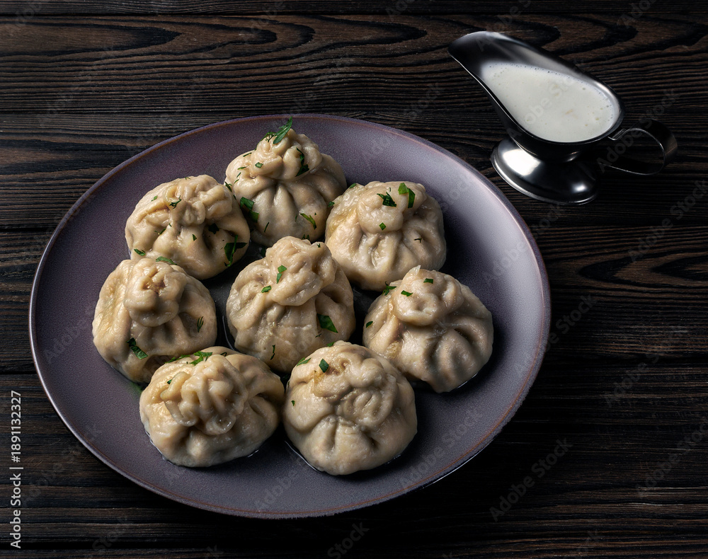 Fototapeta premium Georgian national khinkali with meat and herbs