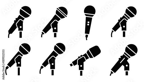 Multiple microphones in silhouette, depicting various angles and styles of microphones used for singing, speaking, and recording audio for music and broadcast