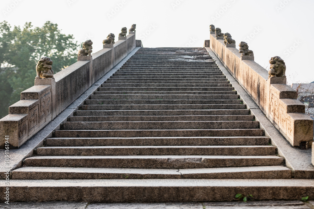 Fototapeta premium Ancient Stone Stairs with Lion Statues at Shuanglin Temple, Huzhou