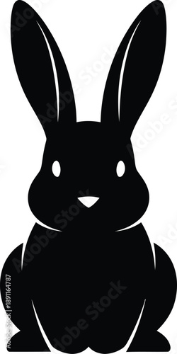 Black silhouette of a rabbit with long ears sitting upright