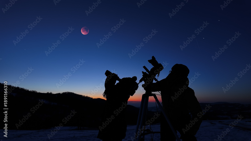 Fototapeta premium Amateur astro-photographers with a camera on a tripod photographing night sky with stars, planets, Moon eclipse and other celestial objects.