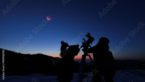 Wallpaper Mural Amateur astro-photographers with a camera on a tripod photographing night sky with stars, planets, Moon eclipse and other celestial objects. Torontodigital.ca