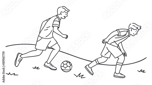 Two boys playing soccer on a grassy field.