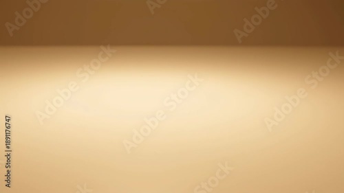 Warm abstract background plate featuring soft light gradient and subtle corner line in rich tan and brown colors. Minimalist textured backdrop.