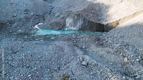 a beautiful ancient glacier. a moraine lake under the glacier. highlands