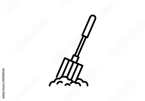 Icono de horca de jardín clavada en un montón de tierra