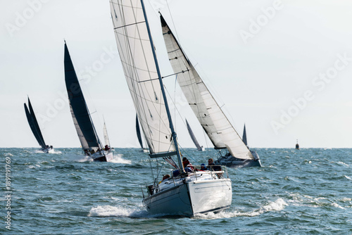 Sailboat Competing in a Sailing Race with Boats in the Background