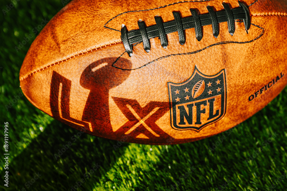 Naklejka premium A shadow in the shape of ‘LX’ with the Lombardi Trophy cast on an American football ball ahead of Super Bowl LX between the Seattle Seahawks and New England Patriots at Levi’s Stadium in Santa Clara