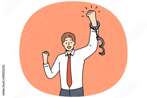 Business man feels joy after being fired from job with bonded working conditions, joyfully waving handcuffed hands. Successful guy celebrates being fired from unloved company with bad bosses