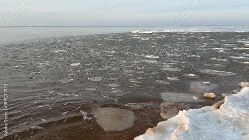 baltic sea beach winter cold  waves jurmala latvia