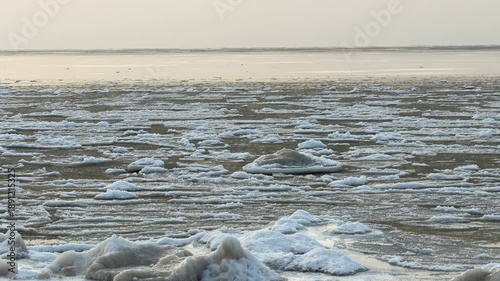 baltic sea beach winter cold  waves jurmala latvia