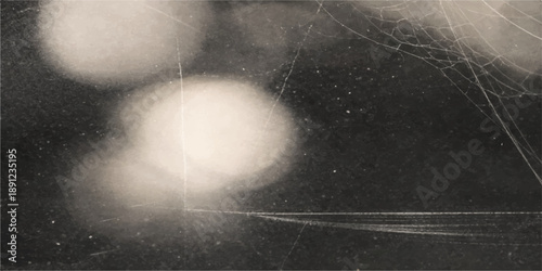 A vintage dark grunge texture features black and white rain drops on a window against a misty grey sky with old smoke patterns and stormy clouds