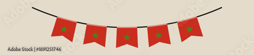 Moroccan flag bunting banner hanging in a festive garland for a national holiday or patriotic celebration.
