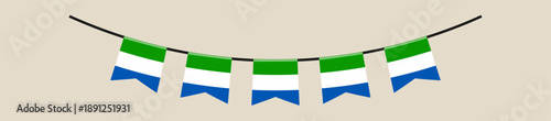 Sierra Leone flag bunting garland hanging on a string for decorating a national holiday or patriotic event celebration.
