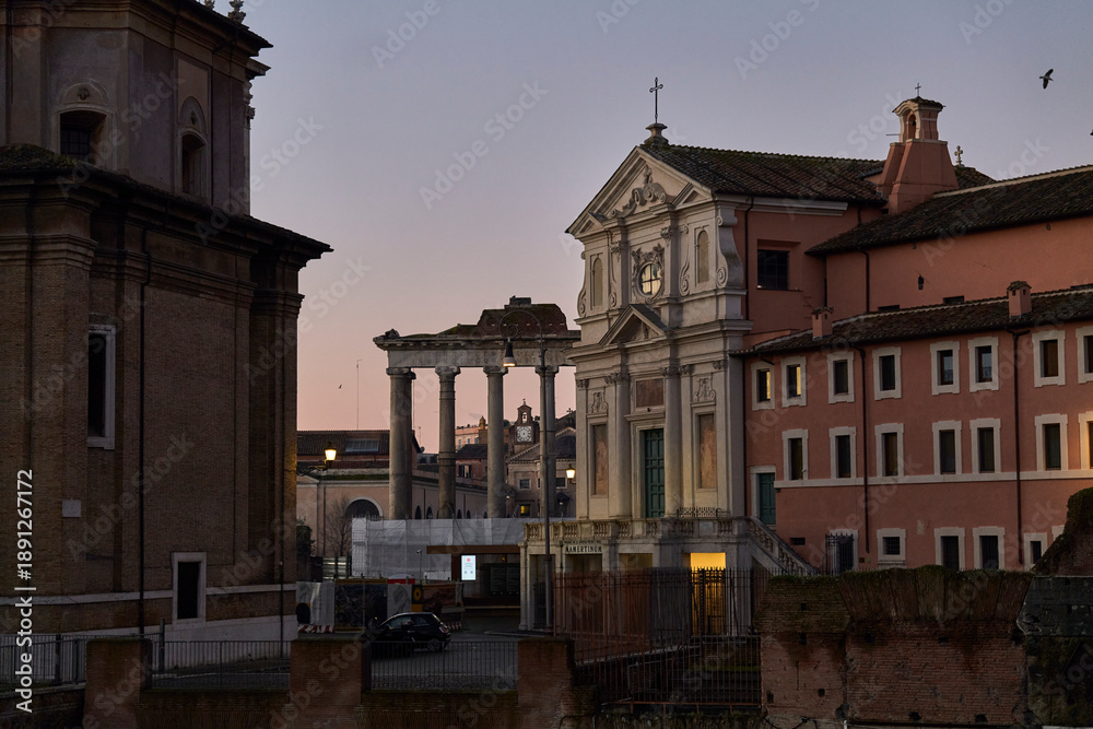 Fototapeta premium View of Mamertine Prison and Ancient Roman Forum Ruins at Sunset