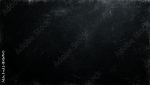 Scratched black surface with white marks and scratches