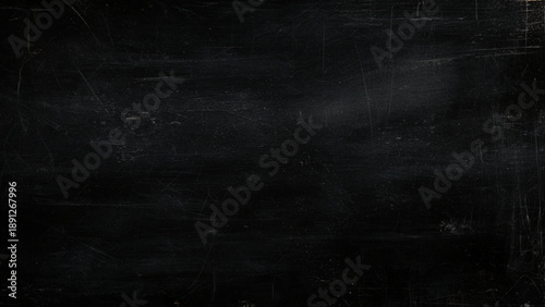 Scratched dark surface with scratches and marks