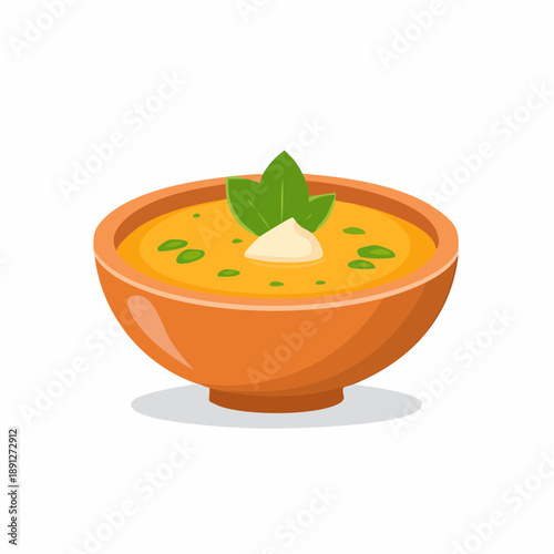 Bowl of creamy orange soup with garnish of herbs and cream for food illustrations