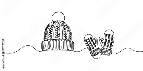 A winter knitted hat with a pom-pom and a pair of mittens on a wavy line, symbolizing warmth, winter holidays, and cozy warm clothing. 