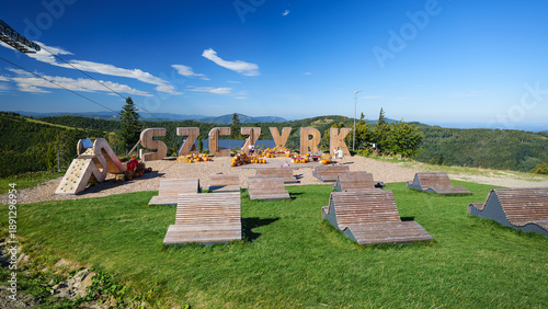 A rest area on Hala Skrzyczeńska. The Szczyrk sign reads: 