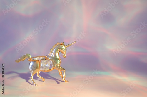 Wallpaper Mural A unicorn figurine on a pink rainbow background. Torontodigital.ca