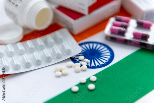 Obraz na plátně A close up of various loose and package medicine on the national flag of India