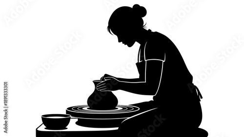 Woman creating pottery on a spinning wheel.