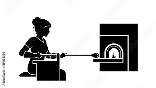 Woman placing pottery in a kiln for firing.