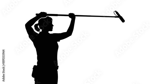 Silhouette of a golfer preparing to hit the golf ball.