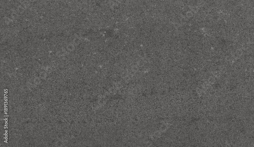 Photography A uniform dark charcoal grey material close-up