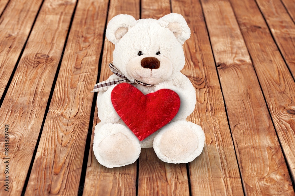 Naklejka premium Teddy Bear hold red heart, love concept
