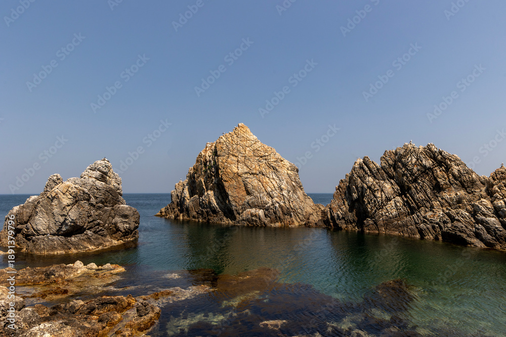 Naklejka premium rocky coast of the sea