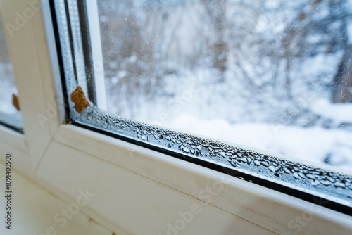 Ice Buildup Windows, Condensation And Cold Drafts Observed, Frozen Glass Surface Indicates Insulation Issues, Signs Of Moisture And Cold Infiltration On Window Frame During Winter