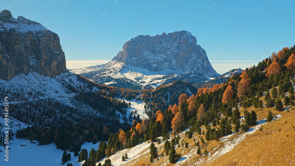 Fototapeta premium Panorama of the Dolomites mountains during autumn sunrise