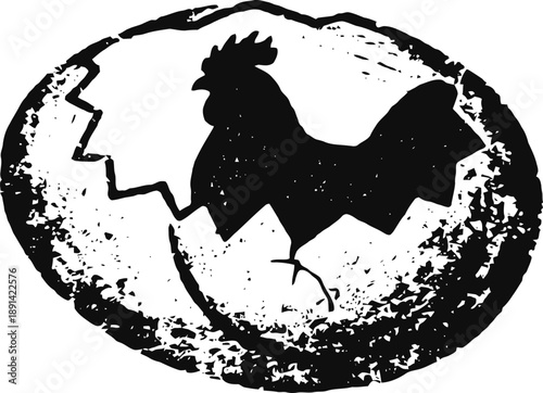 Hatching chick silhouette breaking out of cracked eggshell black and white illustration