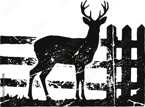 Silhouette of a deer with antlers standing near a rustic wooden fence in black and white