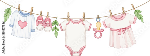 Baby clothes, shoes, and a pacifier drying on a clothesline